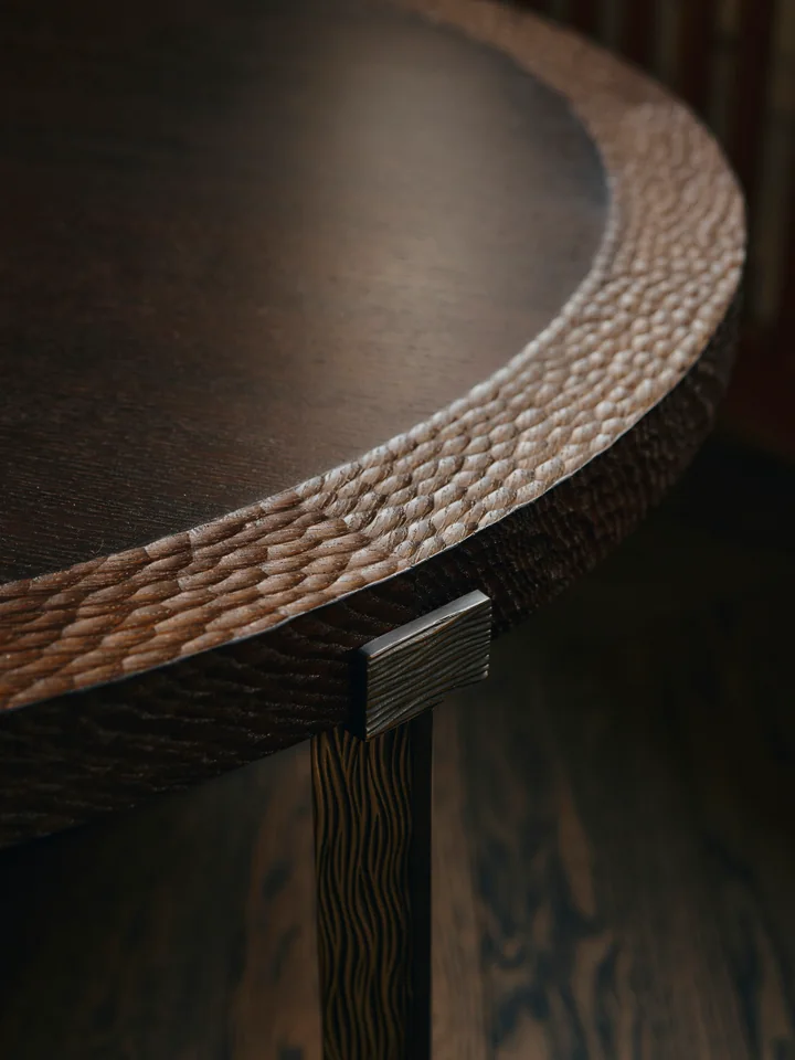 Detail of a hand-carved table edge. Photo: Conny Mirbach
